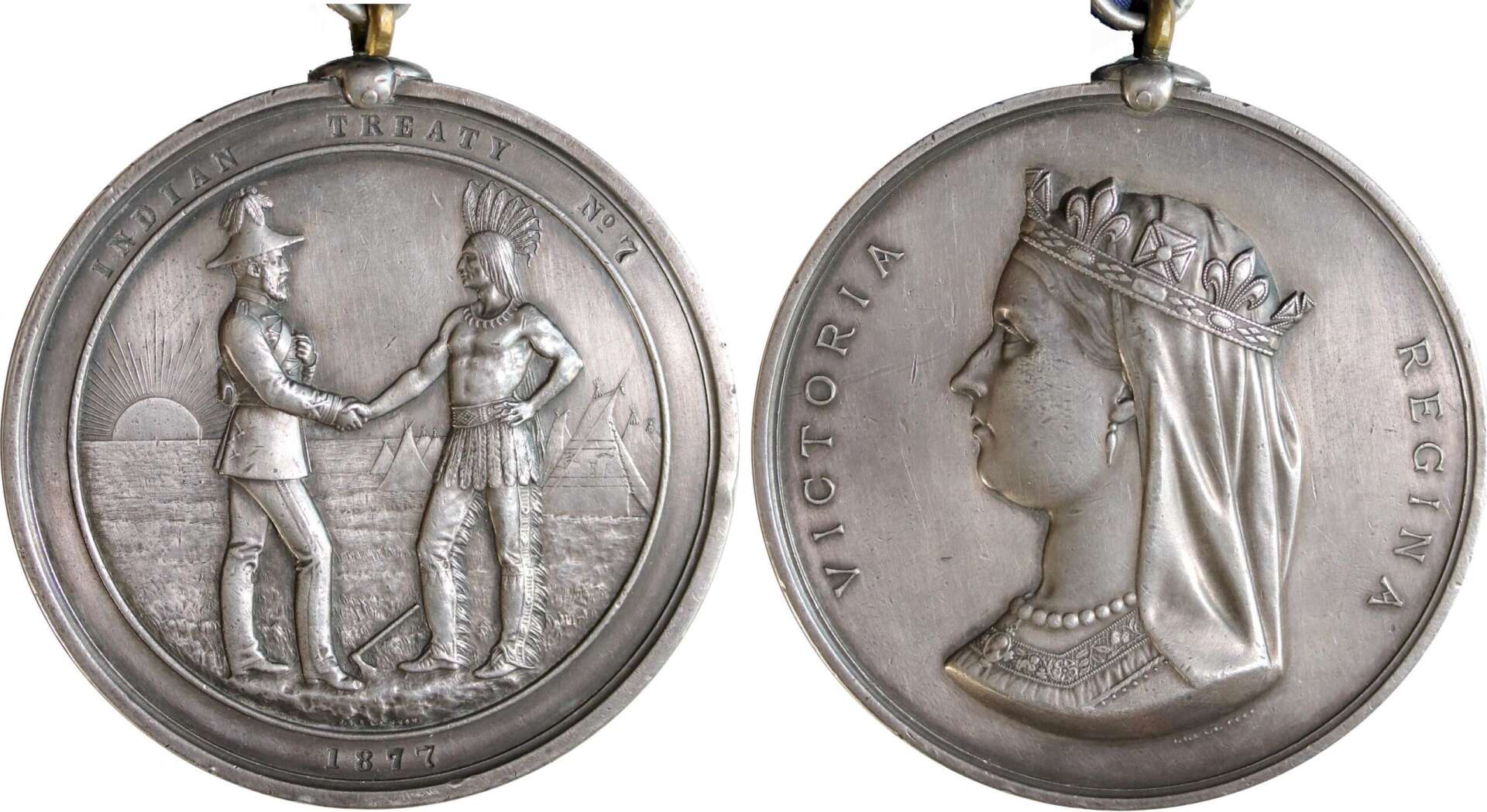 On the left, the reverse of the coin depicts a scene of a second-rank commissioner standing facing right, shaking hands with an Indigenous man in traditional attire facing left, set against a backdrop of teepees and a rising sun. On the right, the obverse